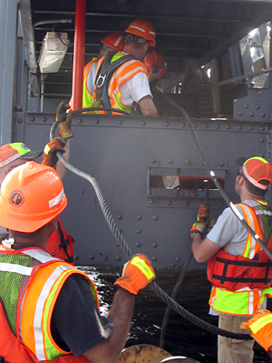 Bridge maintenance crews fix a cable on the Stillwater Lift Bridge.